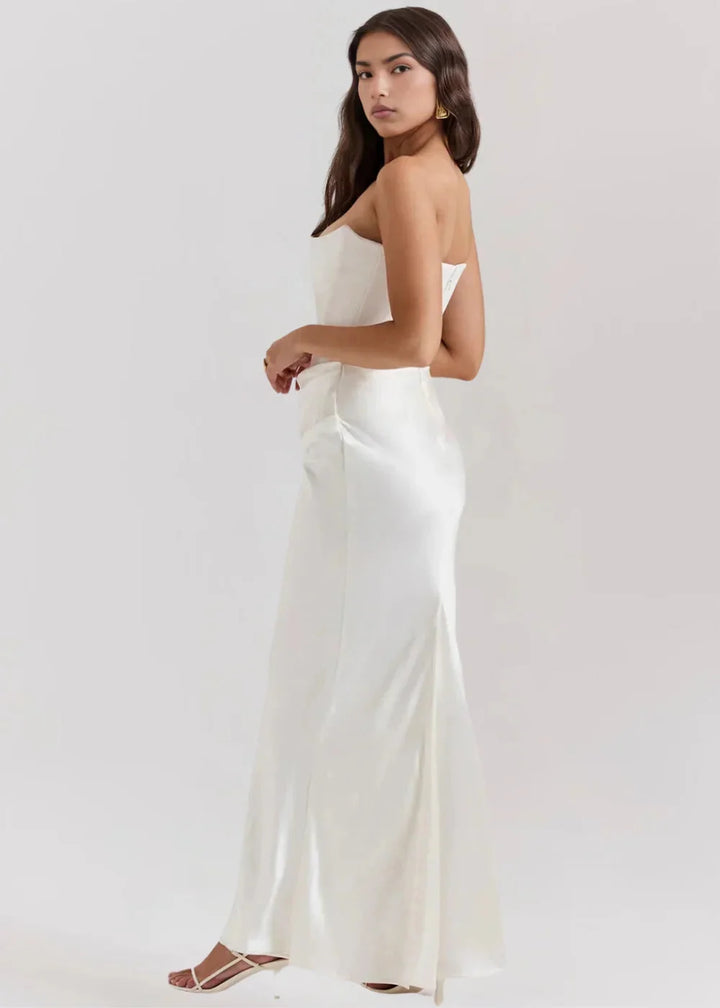 Black strapless evening dress with a sleek design and fitted silhouette. Made with high-quality fabric perfect for special…