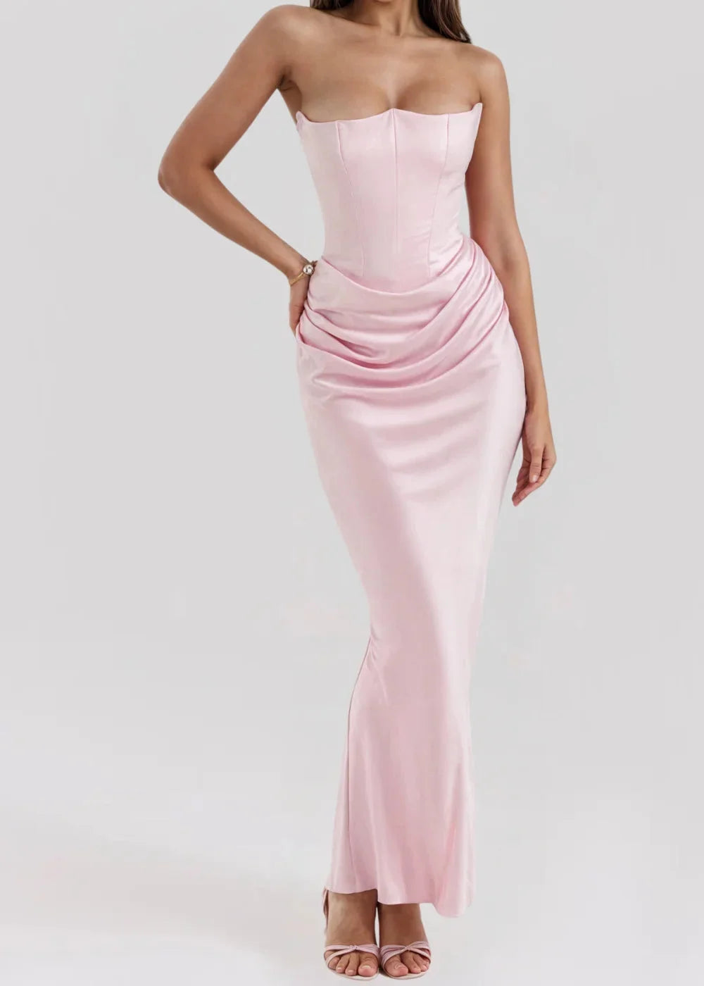 "Pink strapless evening dress in sleek design with a textured fabric, perfect for formal events."