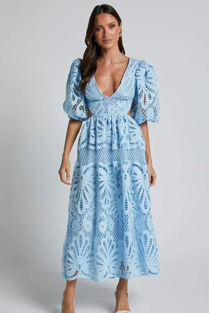 "Black lace mid-length dress with V-neckline, exuding elegance and sophistication"