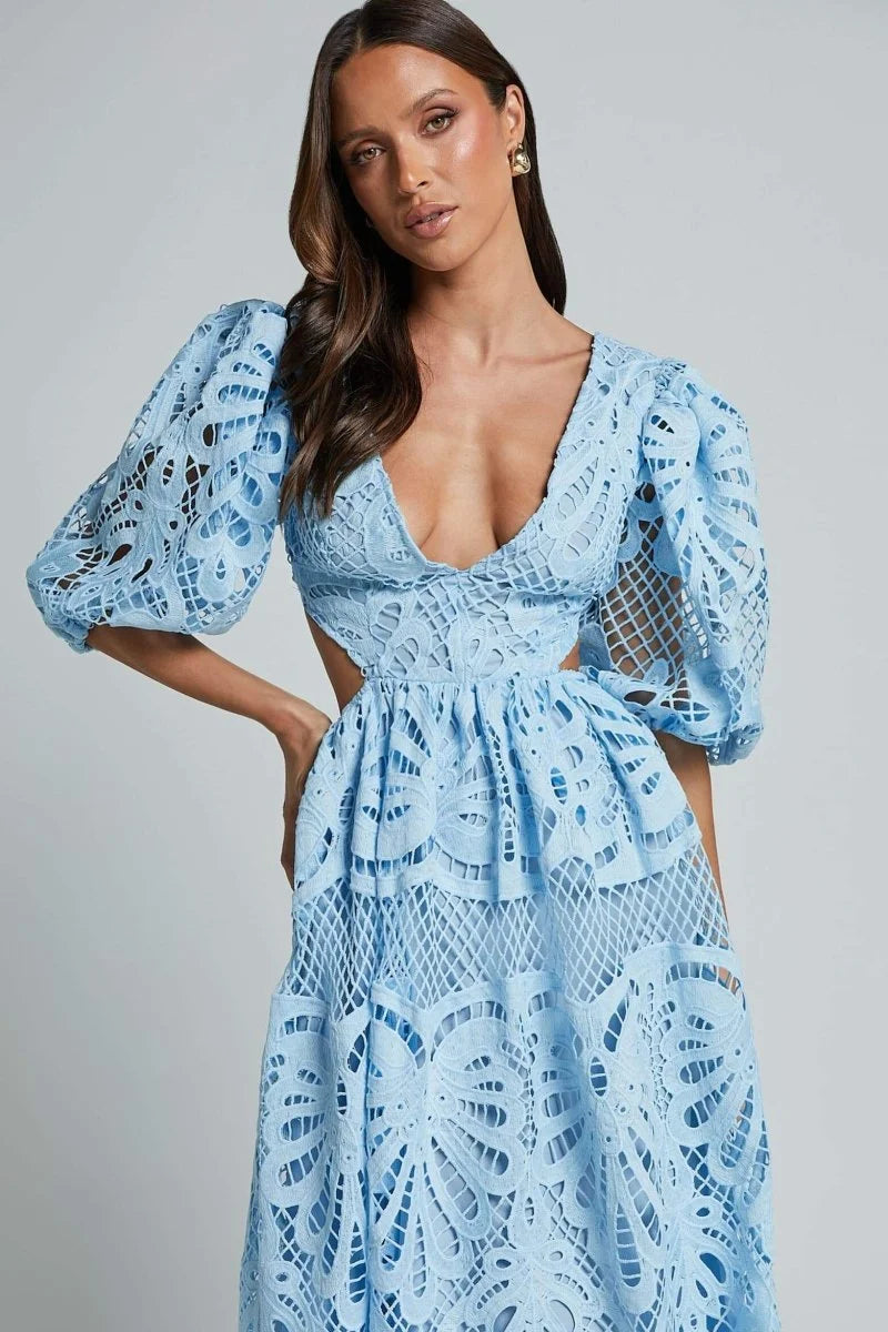 Mid-length lace dress in navy with delicate floral pattern, featuring a flattering V-neckline and intricate lace detailing.