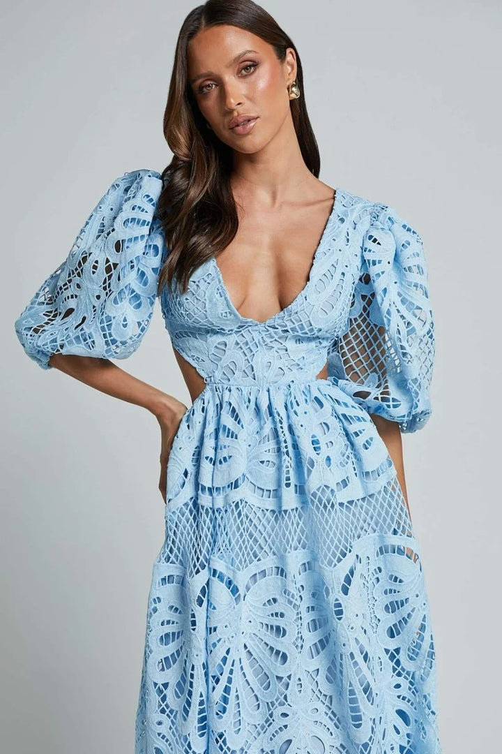 Mid-length lace dress in navy with delicate floral pattern, featuring a flattering V-neckline and intricate lace detailing.