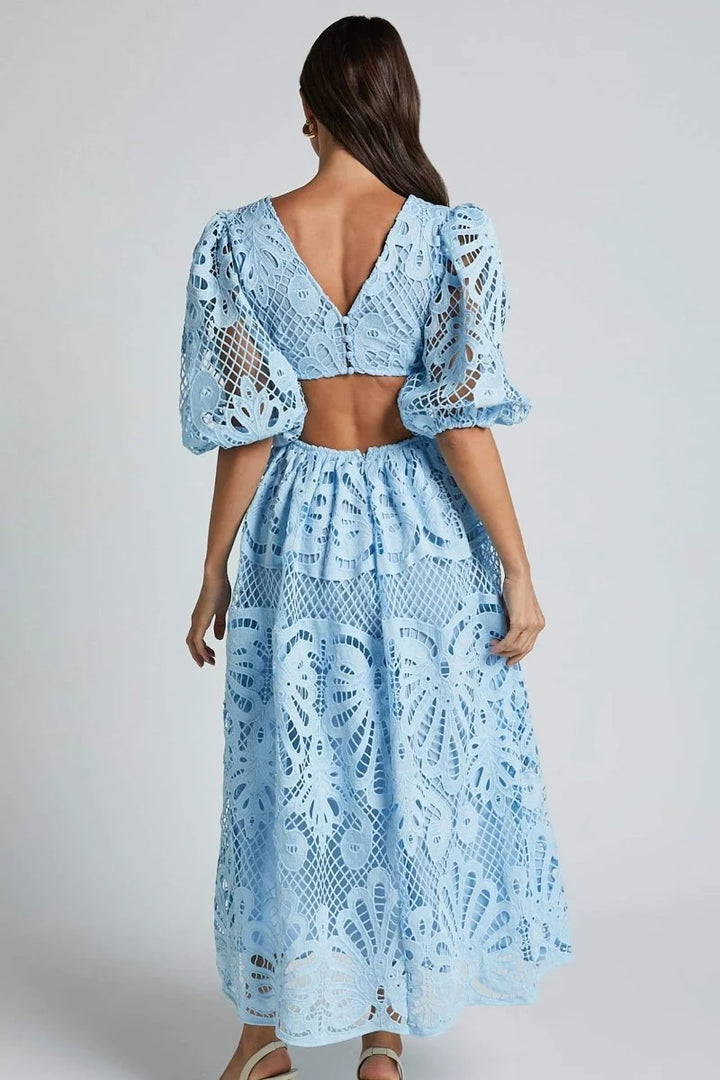 "Gracelynn mid-length lace dress in navy with V-neckline and intricate floral pattern."