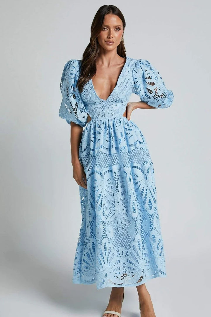 Blue lace dress with V-neckline, knee-length design. Featuring intricate lace details, perfect for any casual or formal…