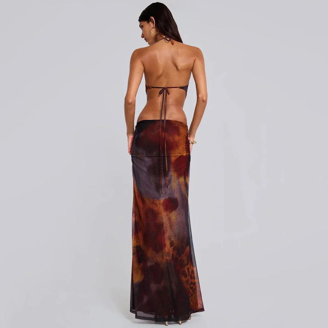 Brown slim-fit maxi dress with gold detail. Features a sleek and elegant design, perfect for a stylish and sophisticated…