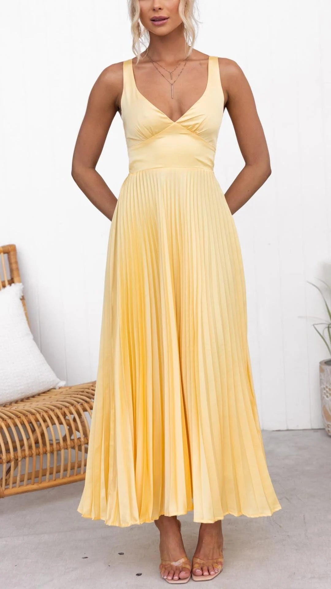 "Yellow maxi dress featuring a flattering v-neck design, perfect for summer occasions, made from lightweight and airy…