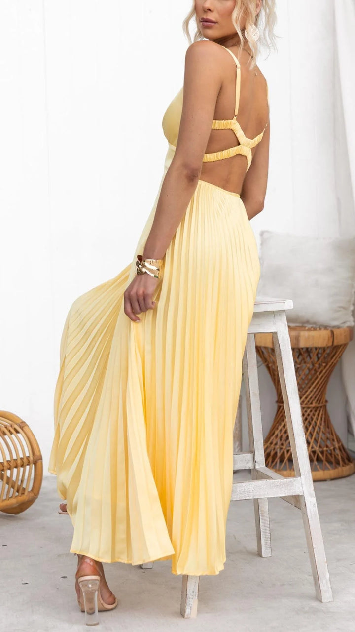 Sunny yellow maxi dress with a flattering v-neck design, perfect for a breezy summer day.