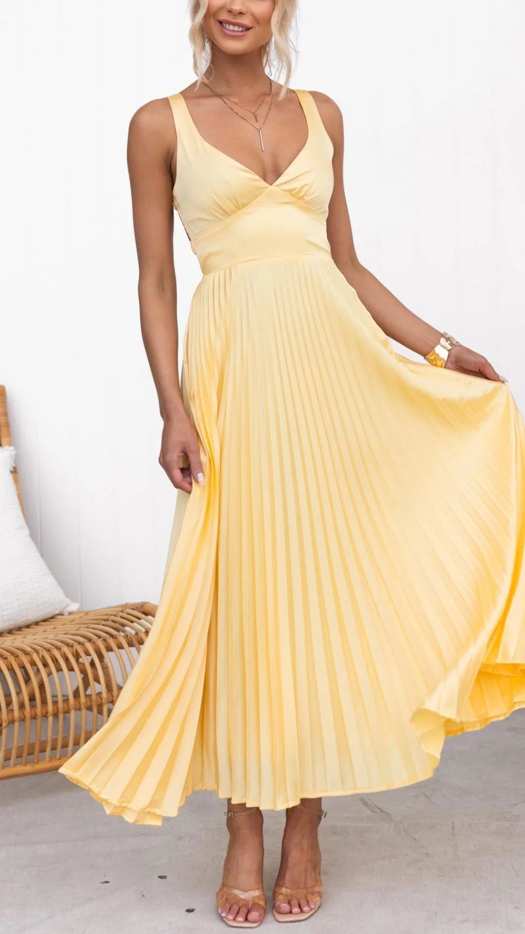 Sunny yellow maxi dress featuring a flattering v-neck design, perfect for warm weather outings.