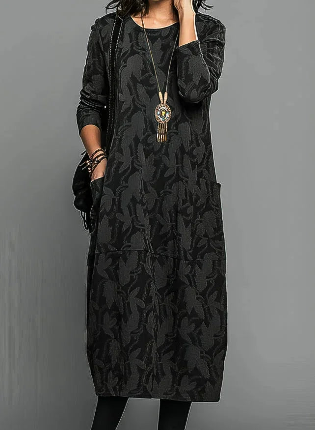 Black textured jacquard midi dress with pockets, perfect for a casual yet elegant look. Made with high-quality fabric, ideal…