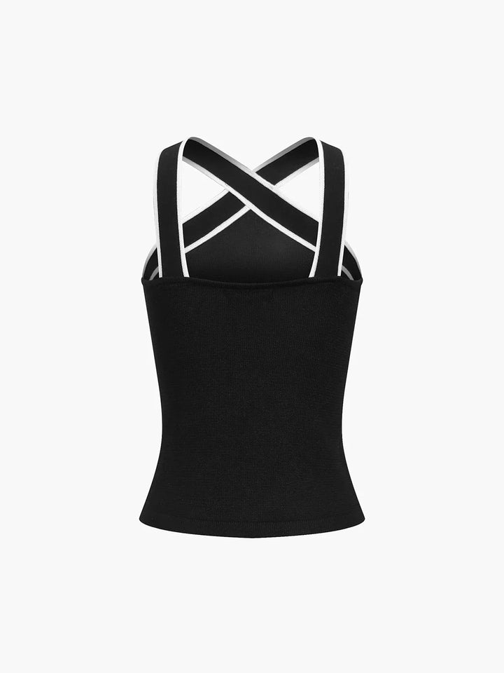 Navy blue slim tank top with crisscross back straps, perfect for workouts or casual wear, made of breathable and stretchy…