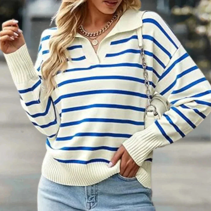 Blue striped zip-up collared pullover made of soft, breathable fabric - perfect for a casual yet stylish look.