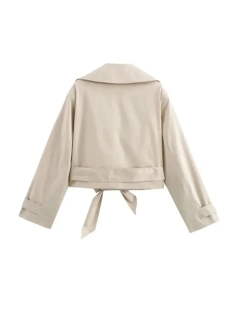 Beige cropped jacket featuring waist tie, made from high-quality fabric with modern design.