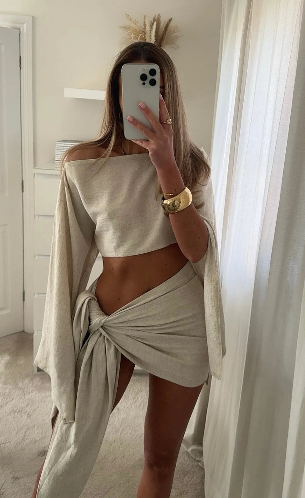 Off White linen two-piece sarong set featuring intricate design details and effortlessly chic style by Hallee.