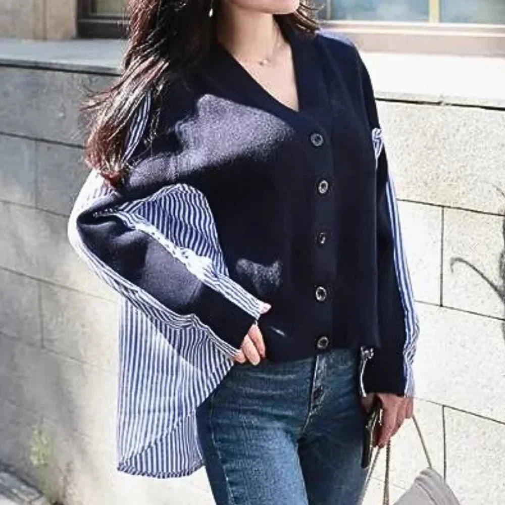 "Navy blue cardigan with striped sleeve accents, crafted from soft knit fabric. Chic and versatile addition to your…