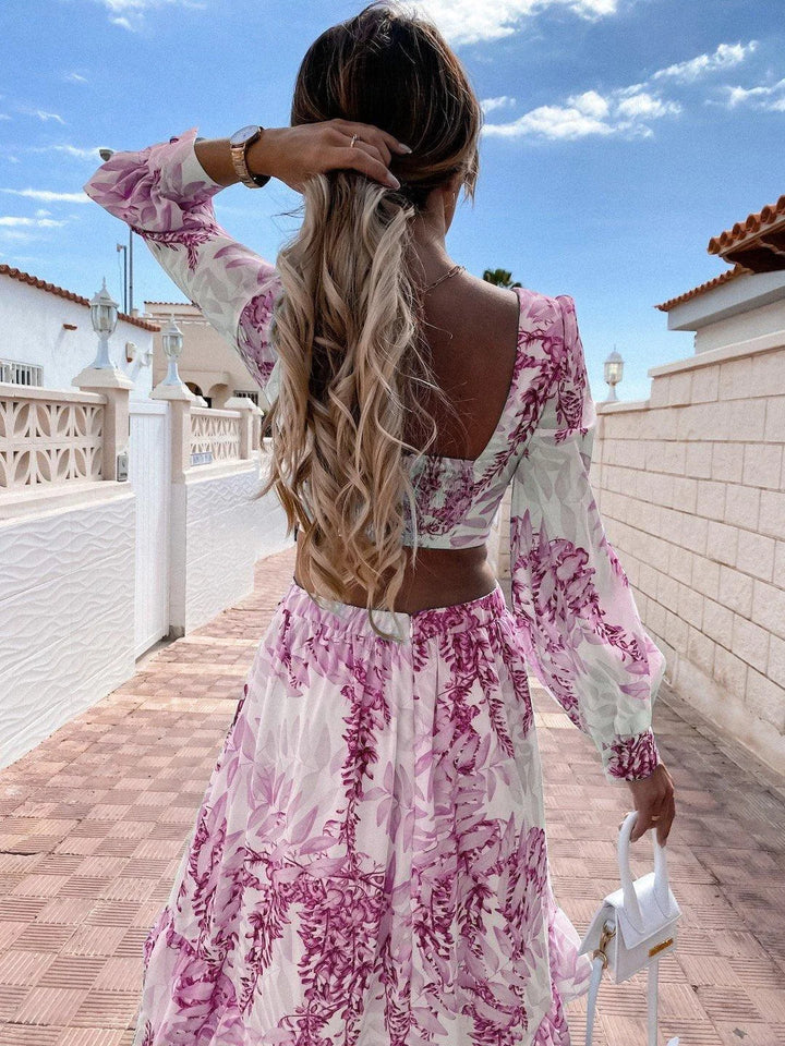 "Flowy maxi dress featuring a vibrant floral print, perfect for a breezy summer day. Made with lightweight and breathable…