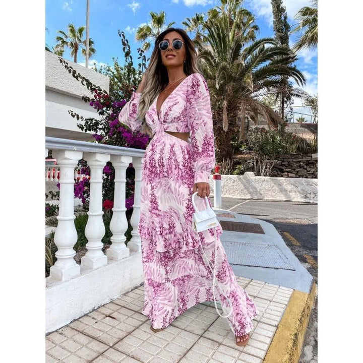 "Flowy purple maxi dress with beautiful floral print design for a bohemian look."