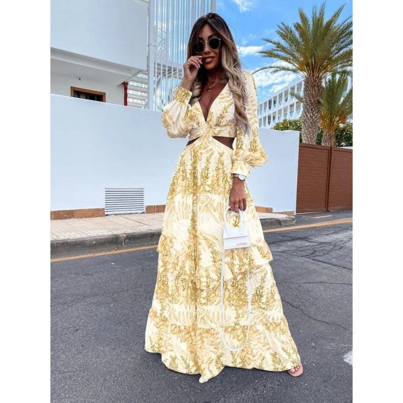 Yellow flowy maxi dress with floral print, perfect for sunny days. Made of lightweight fabric with a flattering silhouette.