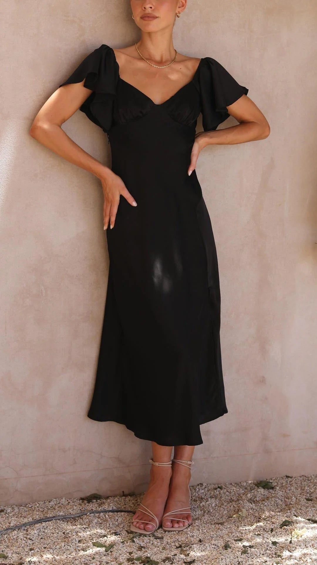 Off-shoulder flowy maxi dress with side slits in a soft, lightweight fabric, perfect for warm weather outings and casual…