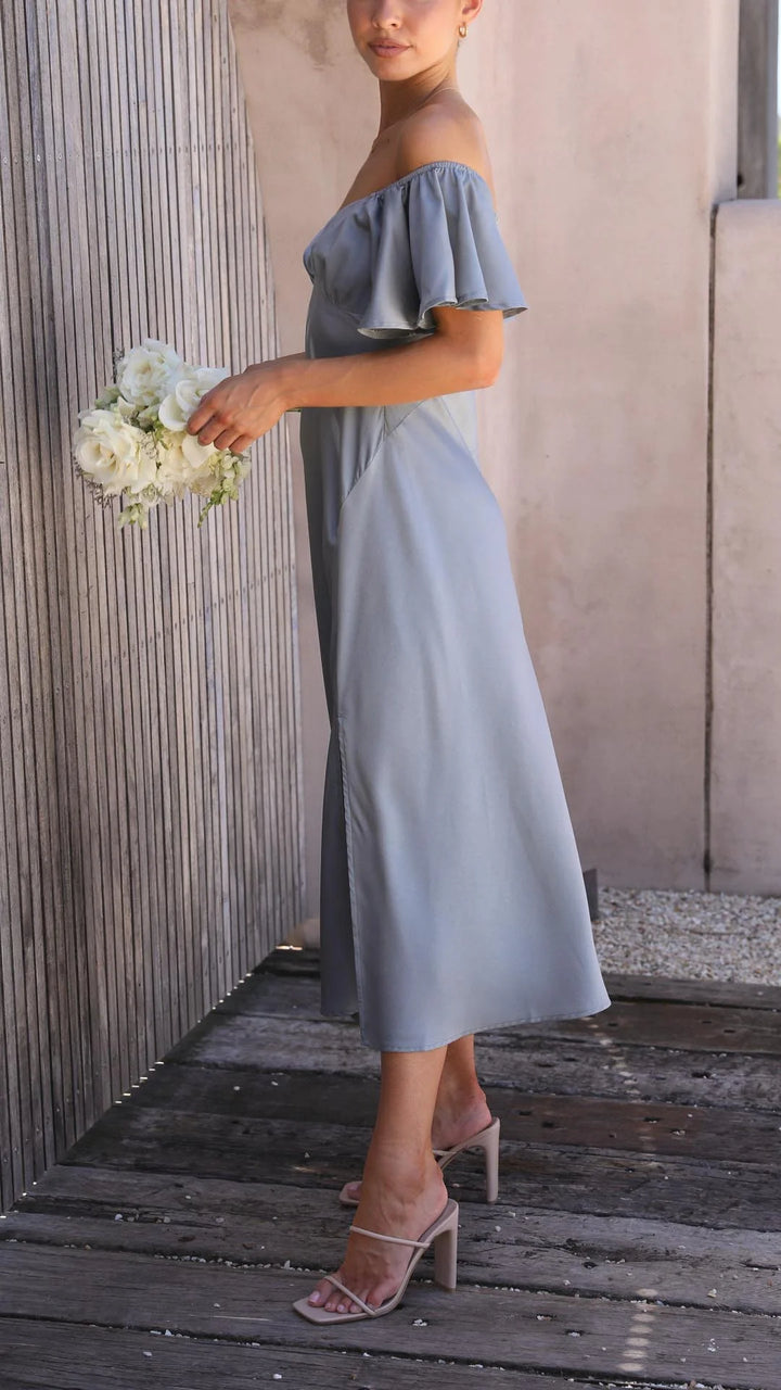 Off-shoulder maxi dress with elegant flowing design and slits. Made of lightweight, breathable fabric perfect for summer…