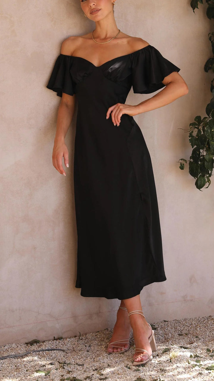 "Black off-shoulder maxi dress with thigh slits in flowy fabric, perfect for elegant summer occasions."