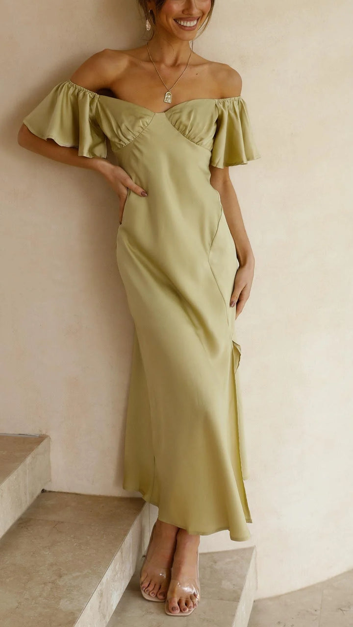 Off-shoulder maxi dress made of flowy fabric with stylish slits. Perfect for a chic and feminine look.