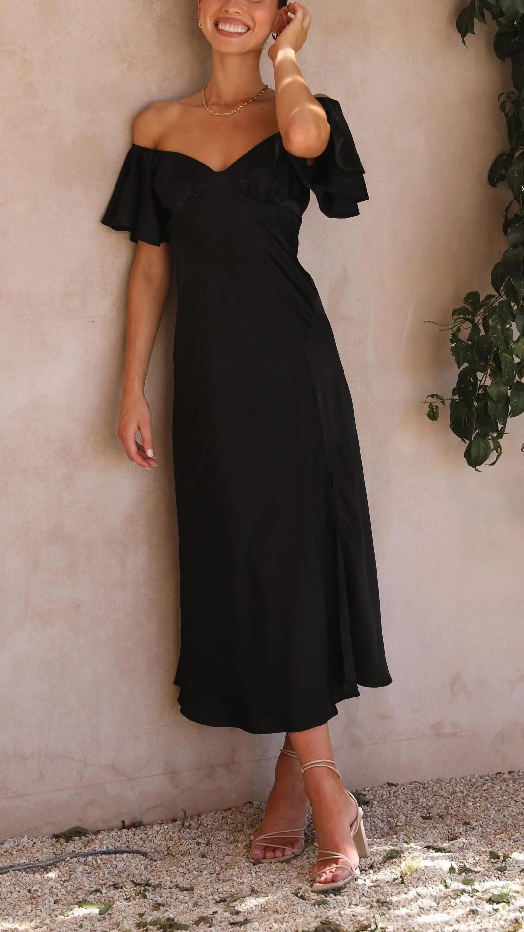 Off-shoulder maxi dress with slits in lightweight fabric perfect for summer; relaxed, flowy fit and stylish design named…