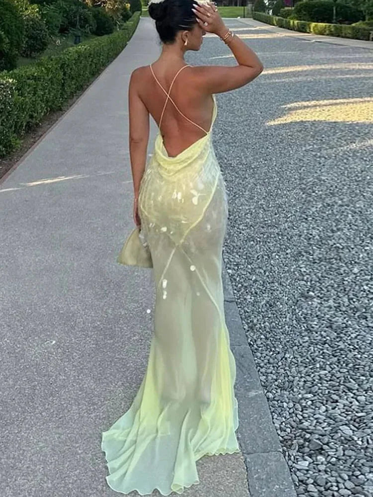 Yellow sheer maxi dress with sequins, perfect for a sunny day out. Embellished with delicate sequins, flowy design for a…