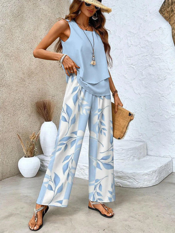 Sleeveless top with printed pants set in soft cotton blend fabric, featuring a stylish design for casual comfort and…