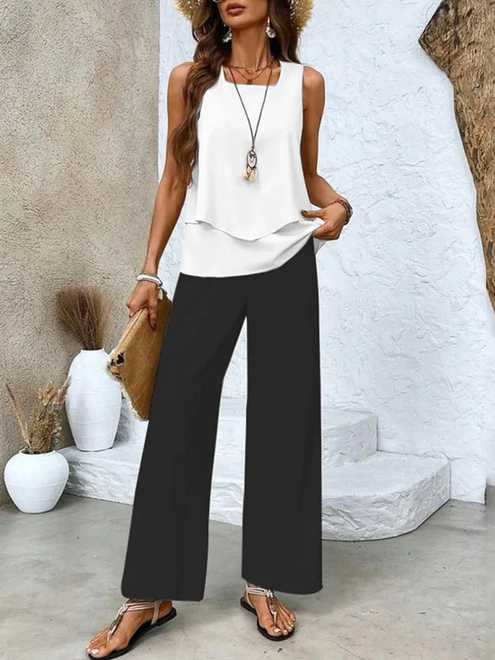 "Black Sleeveless top with printed pants set featuring a modern design, perfect for a casual and comfort-chic look."