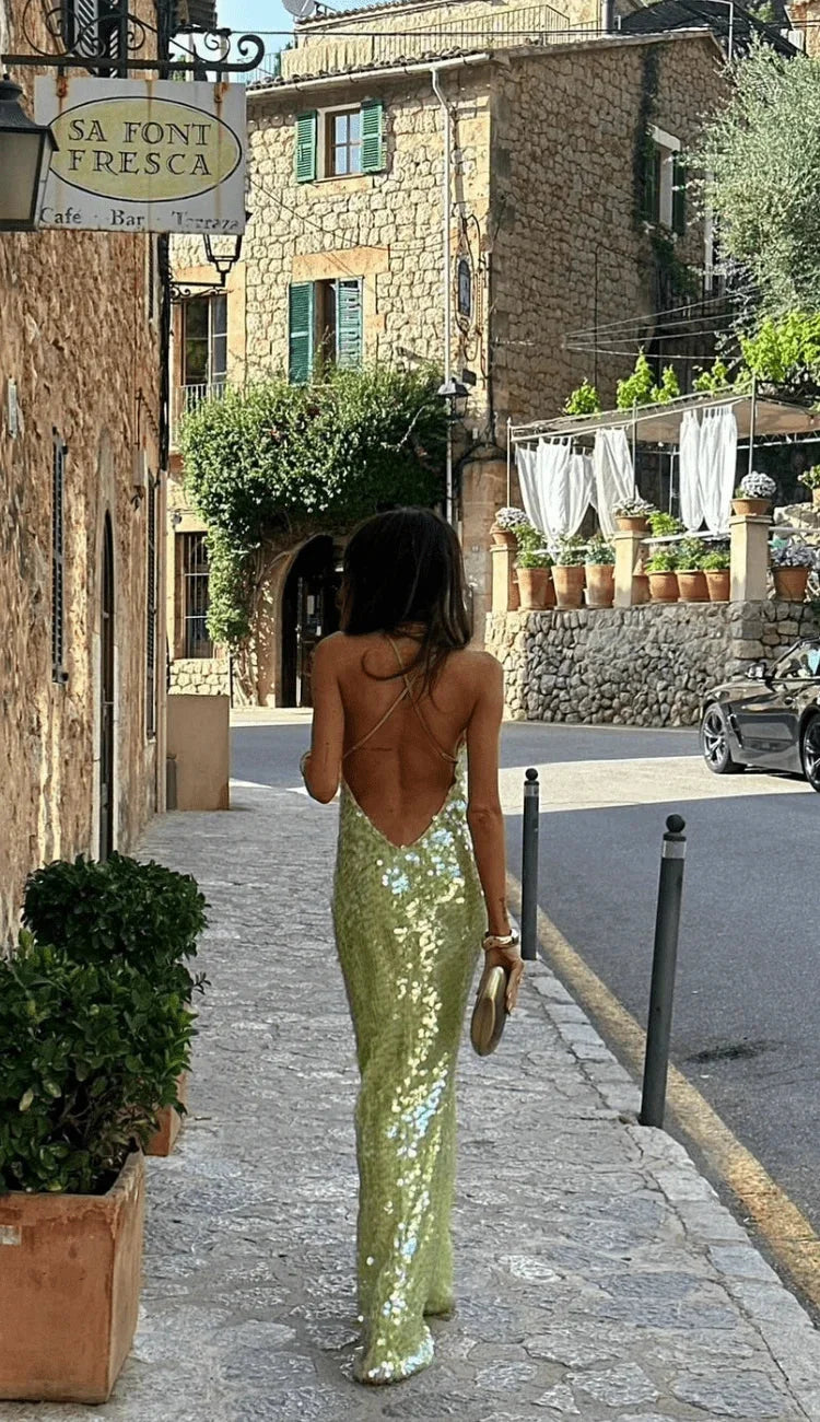 Lime green sequined dress with thin straps, perfect for a glamorous night out.