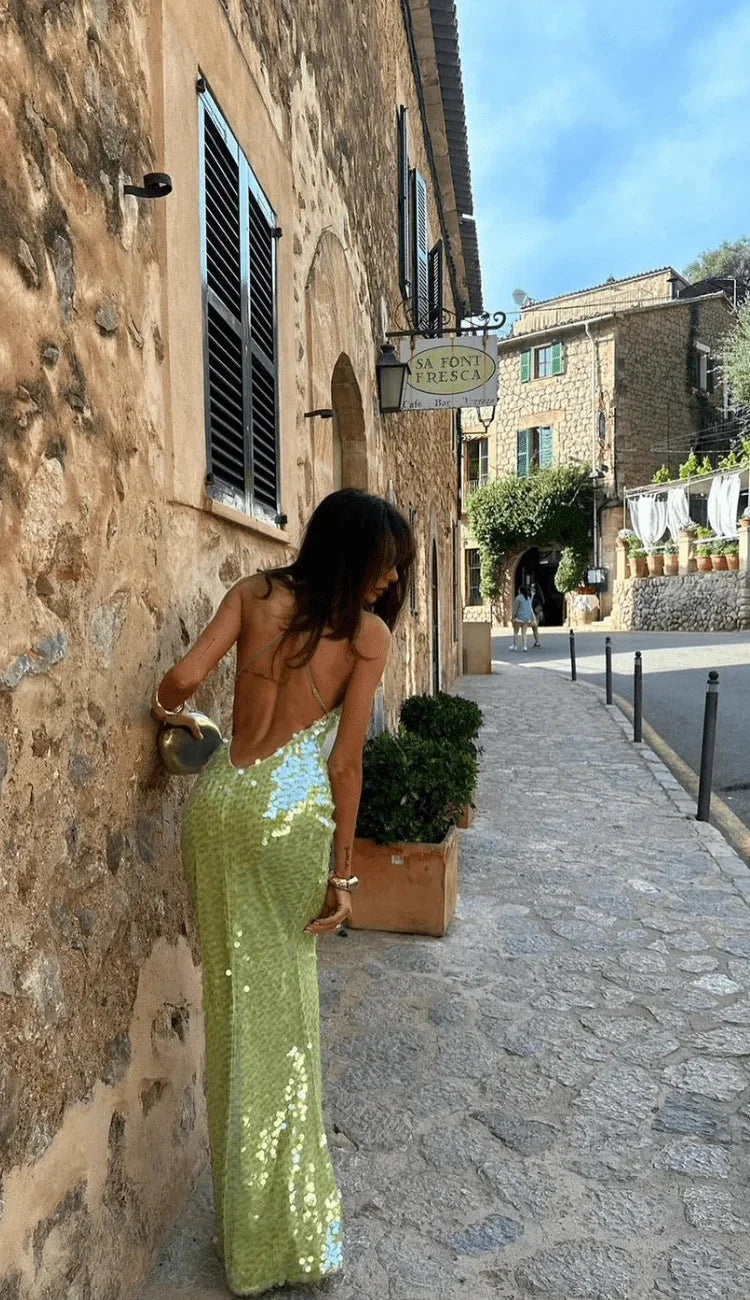 Sequined lime dress with thin straps, perfect for a night out. Shimmery fabric and stylish design make a standout statement…