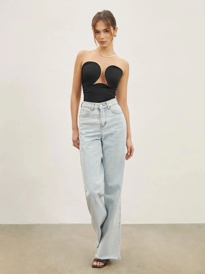 Black strapless top with sweetheart neckline by Honor. Sleek design with a structured fit.