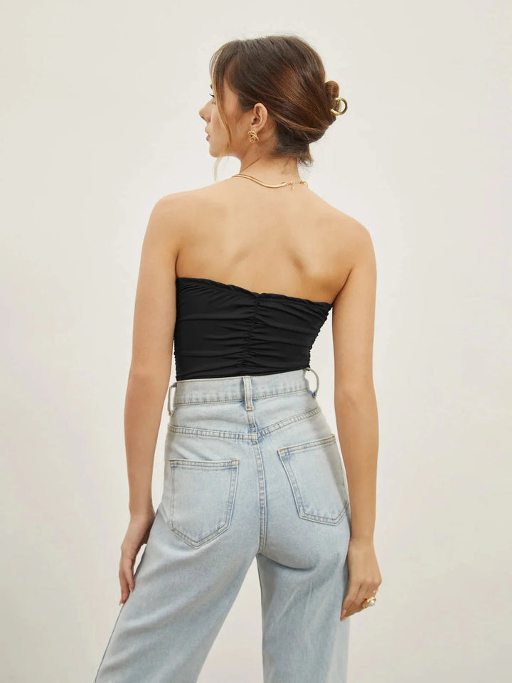 Black strapless top with sweetheart neckline by Honor. The top is elegant, featuring a sleek design that flatters any…