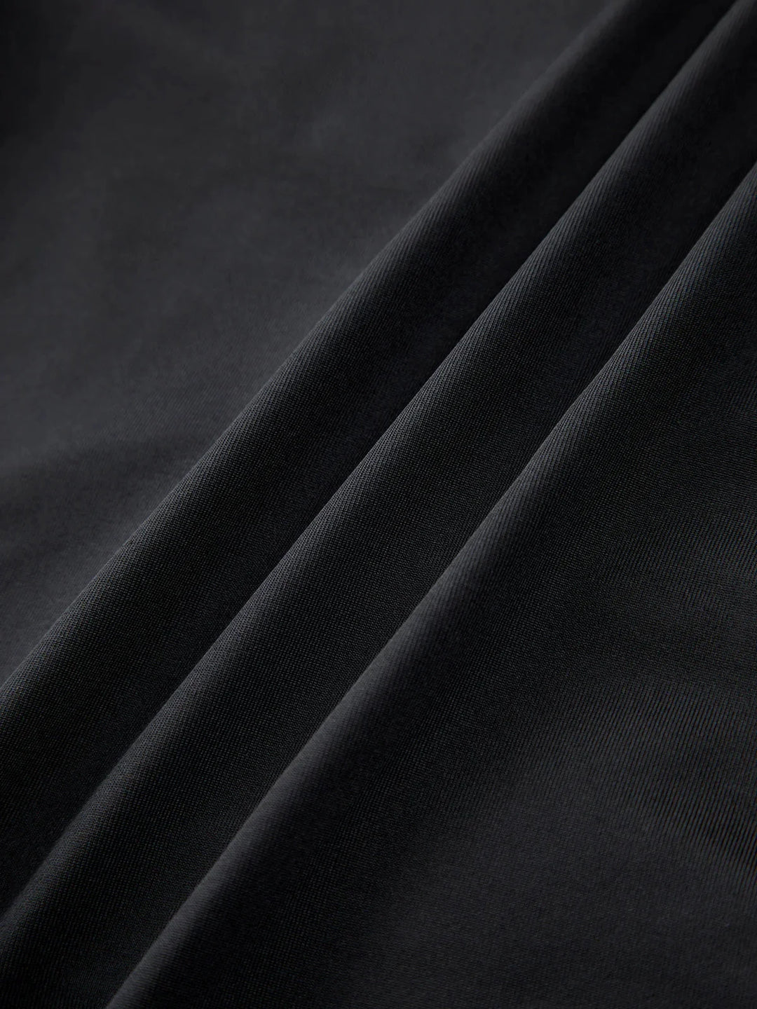 Strapless black top with sweetheart neckline, a timeless and elegant design for versatile styling.