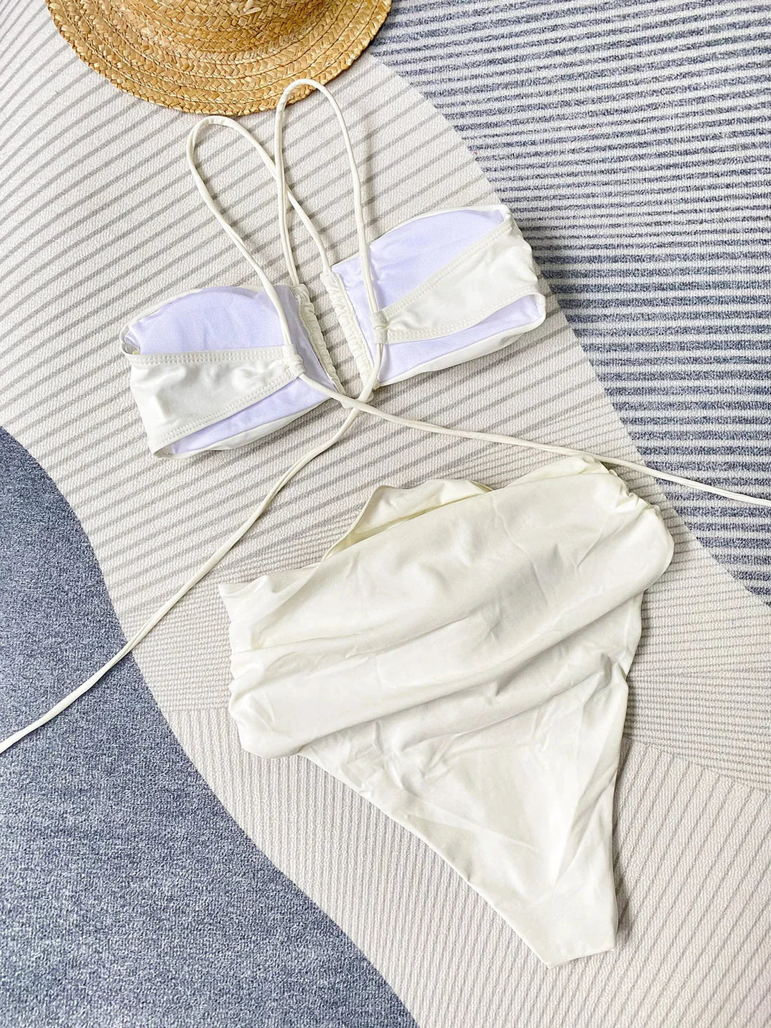 Women’s bikini set featuring rose appliqué design on light blue fabric, perfect for a fun day at the beach.