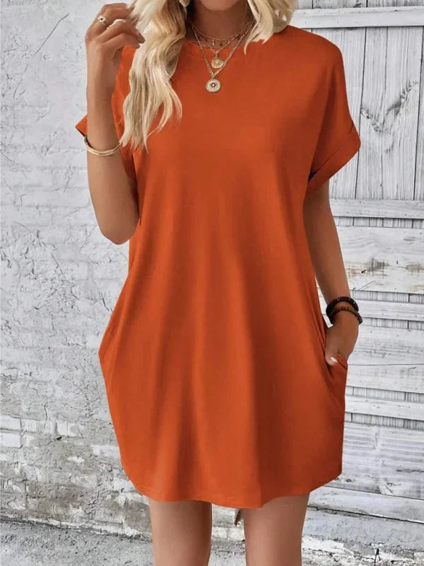"Grey mini dress with pockets, soft cotton blend fabric, perfect for everyday wear or casual outings."