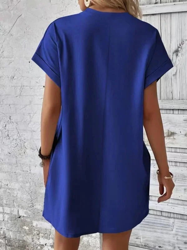 "Black mini dress with side pockets and v-neck made with soft cotton blend fabric"