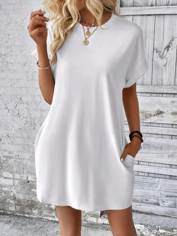 "Black mini dress with pockets made from soft cotton blend, perfect for all-day comfort and style."