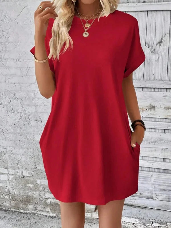 "Black mini dress with pockets, made from soft, stretchy fabric. Versatile and comfortable for daily wear."