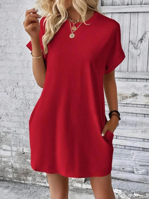 "Black mini dress made of soft cotton blend with handy pockets - perfect for everyday wear."
