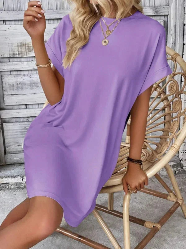 "Grey mini dress with pockets, made of soft cotton blend. Versatile and comfortable."
