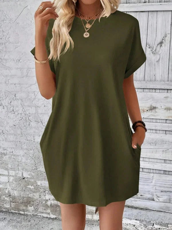 Versatile mini dress in soft, breathable fabric with convenient pockets for everyday comfort and practical style.