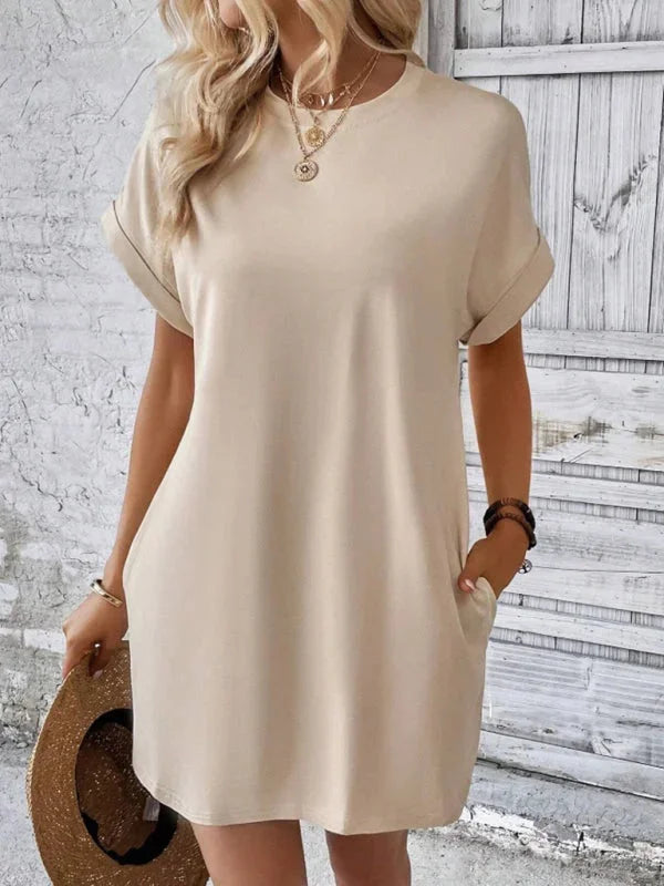 Khaki mini dress with pockets, comfortable fabric and versatile design for everyday wear.
