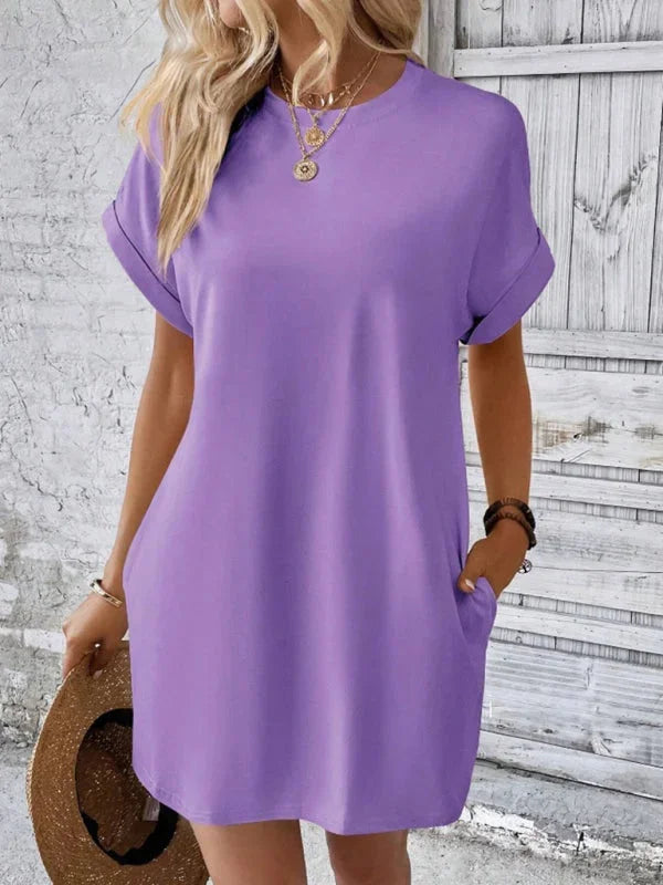 Purple mini dress with convenient pockets. Made of soft and comfortable material. Versatile piece for everyday wear.