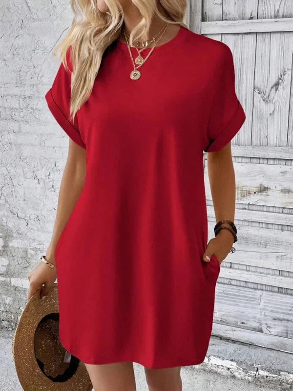 Red mini dress made from soft cotton blend with convenient pockets and a comfortable fit.