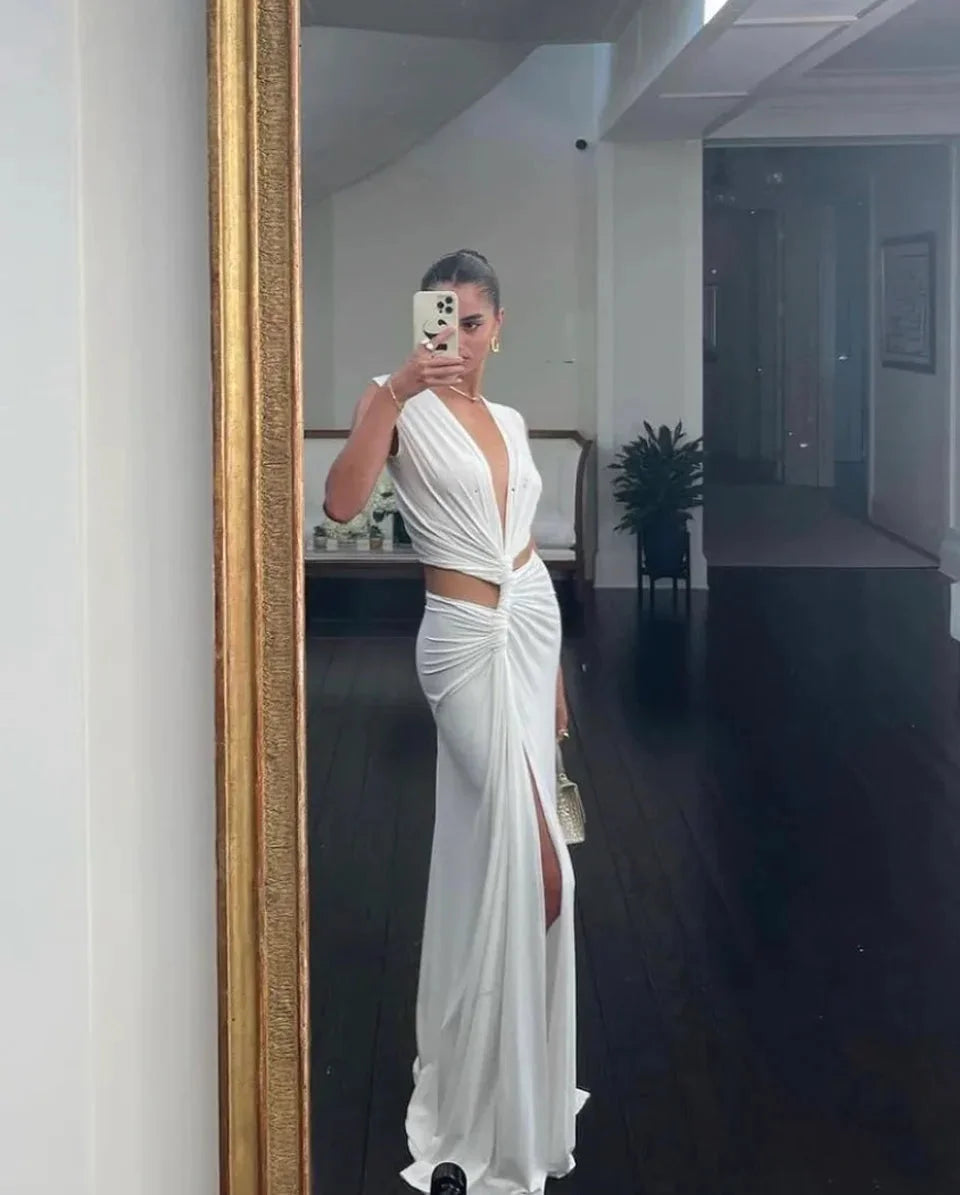Black maxi dress with plunging V-neck and thigh-high slit. Made of soft, flowy fabric perfect for special events and outings.