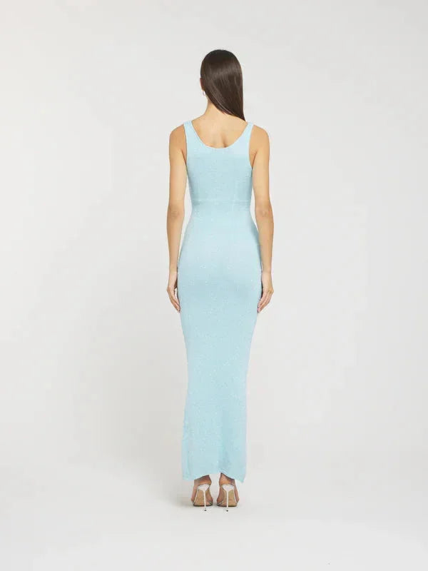 "Sleeveless fitted maxi dress in icy blue, made of lightweight fabric with a flattering cinched waist and flowing hem."