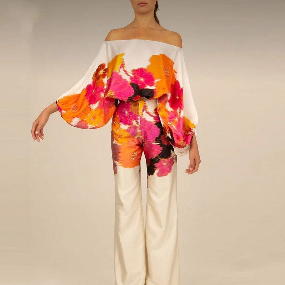 White off-shoulder blouse and straight pants set with a relaxed fit. Great for casual or semi-formal occasions.