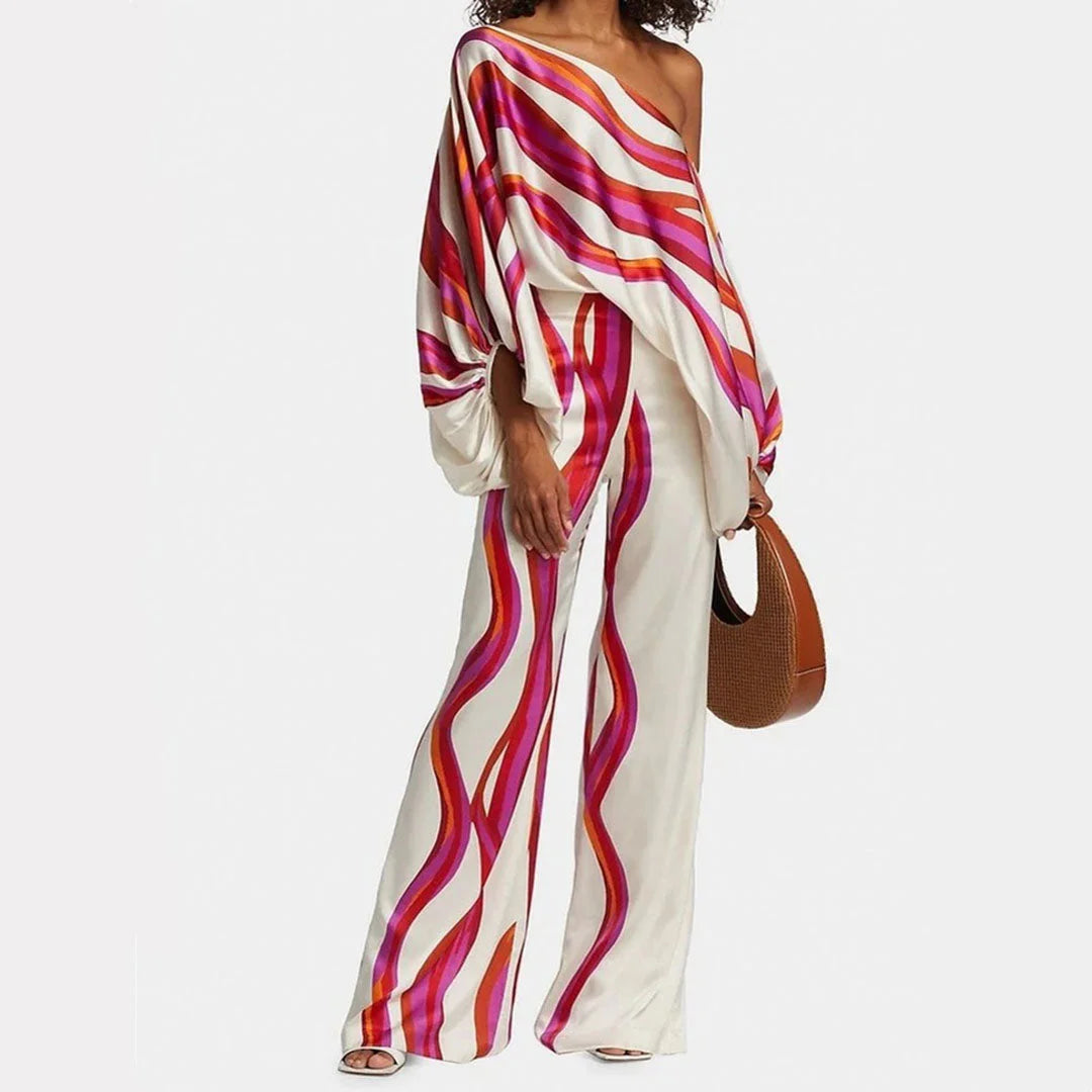 Fuschia off-shoulder blouse and straight pants set made of soft cotton blend fabric with a flattering and stylish design.