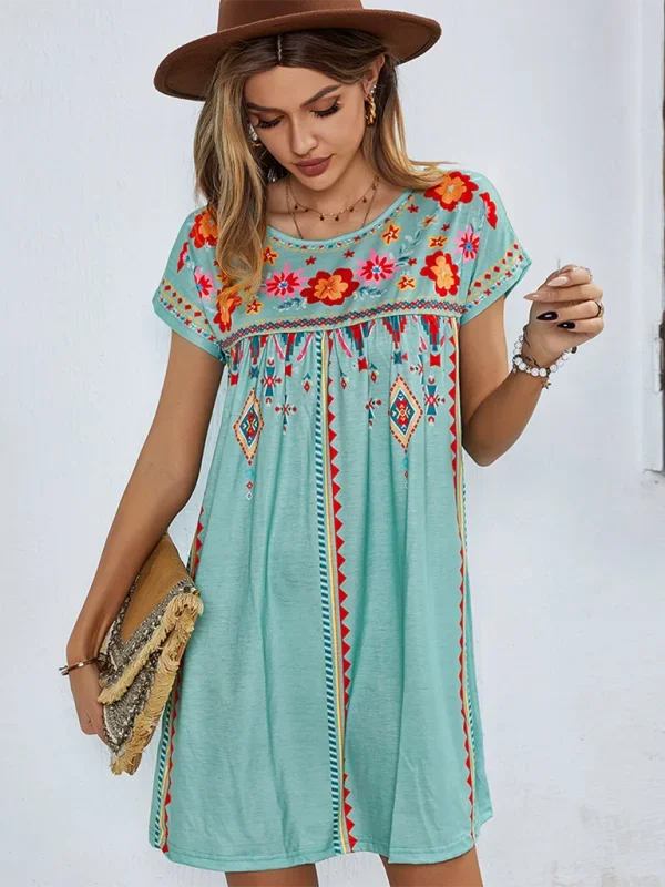 "Jaclyn embroidered boho mini dress featuring floral embroidery on lightweight linen blend fabric in a relaxed fit."