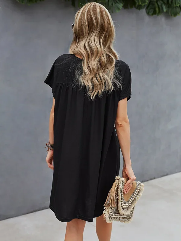 "Bohemian-inspired mini dress with intricate embroidery details on a light, flowy fabric, perfect for casual summer days."